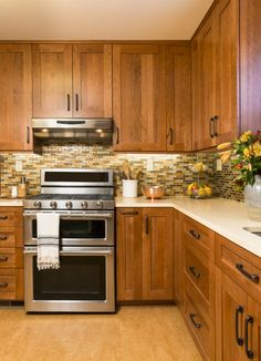 a kitchen with stainless steel appliances and wooden cabinets is featured in the service advert