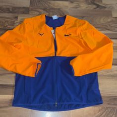 New Nike Rafa Tennis Jacket Size: Large Color: Blue Orange Brand New With Tags Orange Outerwear For Sports In Fall, Orange Long Sleeve Sporty Windbreaker, Orange Sporty Long Sleeve Track Jacket, Sporty Orange Long Sleeve Outerwear, Orange Long Sleeve Sports Outerwear, Tennis Jacket, New Nike, Men's Nike, Blue Orange