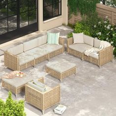 an outdoor living area with wicker furniture