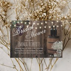 the rustic bridal shower sign is next to some baby's breathflowers