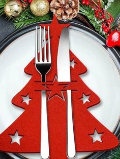 a christmas tree shaped plate with silverware on it