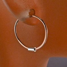 Small lightweight everyday earrings you can sleep in. Great for children, if you are looking for a secure small earring. Choose the metal for the hoop. -one PAIR of hoops -half inch -choose your metal - 14k rose gold filled / 14k yellow gold filled / sterling silver / niobium -the tube bead remains sterling but the hoop can change to whatever metal you prefer -standard ear wire gauge (20 gauge) -rounded and polished wire ends -shiny polished hoops A QUALITY PRODUCT - good clean even circles This Nickel Free Hoop Cartilage Earrings For Everyday, Adjustable Dangle Hoop Earrings In Rose Gold, Rose Gold Nickel-free Hoop Earrings As Gift, Gift Rose Gold Nickel-free Hoop Earrings, Adjustable Rose Gold Hoop Earrings Gift, Nickel Free Rose Gold Hoop Earrings For Gift, Nickel-free Rose Gold Hoop Earrings For Gift, Nickel-free Hoop Cartilage Earrings Gift, Adjustable Nickel Free Rose Gold Hoop Earrings