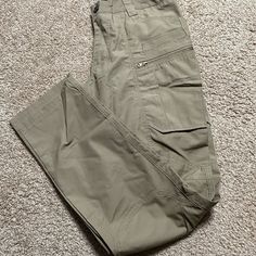 New Without Tags Unisex Khaki Tactical Outdoor Work Pants, Tactical Khaki Work Pants For Outdoor, Tactical Khaki Pants With Pockets, Tactical Khaki Cargo Pants With Multiple Pockets, Khaki Tactical Cargo Pants With Multiple Pockets, Tactical Khaki Cargo Pants For Outdoor Work, Tactical Khaki Cotton Bottoms, Tactical Khaki Bottoms For Outdoor Work, Tactical Khaki Bottoms With Side Pockets