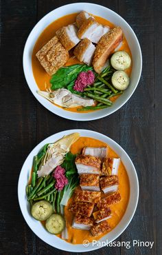 two bowls filled with different types of food on top of a wooden table next to each other