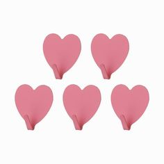 six pink heart shaped paper clips on a white background