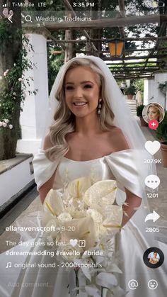 a woman in a wedding dress holding a bouquet and smiling at the camera with her phone