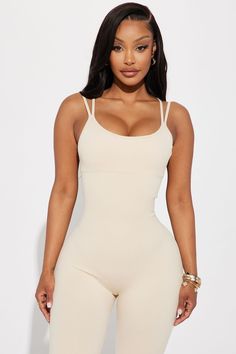 Available In Sand. Jumpsuit Crew Neck Sleeveless Spaghetti Straps Removable Cups Strappy Back Elastic Back Stretch 92% Nylon 8% Elastane Imported | Effortless Joyce Ribbed Seamless Jumpsuit in Sand size Large by Fashion Nova Summer Sleeveless Shaping Bodysuit, Seamless Spaghetti Straps Bodysuit For Loungewear, Summer Shaping Bodysuit In Beige, Beige Shaping Bodysuit For Summer, Seamless Shapewear Camisole For Summer, Summer Shaping Beige Bodysuit, Seamless Solid Color Jumpsuits And Rompers With Spaghetti Straps, Seamless Solid Color Bodysuit With Spaghetti Straps, Summer Beige Shaping Bodysuit