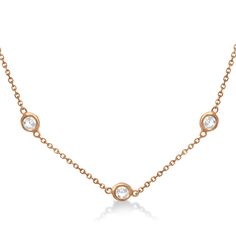 Style Number - AZ18857
Set in a 14k rose gold (pink gold) bezel style setting, this lab grown diamonds by the yard necklace is equal parts unique and elegant. 7 brilliant-cut nearly colorless G-H color, and SI1-2 clarity round lab grown diamonds wrap half way around this station style necklace to keep all eyes on her.Available in other lab grown diamond carat weights, and in 16, 18, 20 and other lengths. If you would like this necklace in a different length please contact us. Rose Gold Diamond Necklace With Bezel Setting, Rose Gold Round Cut Diamond Necklace With Bezel Setting, Rose Gold Diamond Necklace With Bezel Setting For Anniversary, Diamonds By The Yard Necklace, Diamonds By The Yard, Bezel Set Necklace, Rose Gold Chain, Rose Gold Pink, Gifts For My Wife