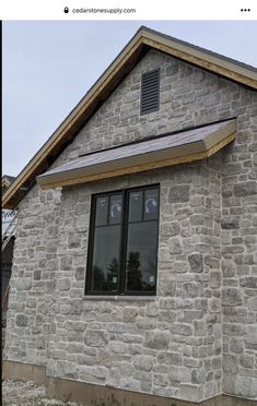 an image of a stone building with windows