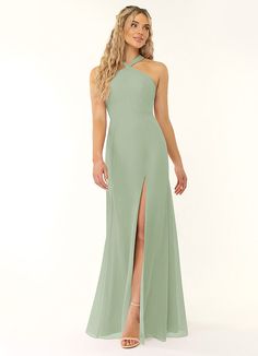 a woman in a long green dress with a slit down the side and one leg