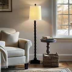 a living room scene with focus on the floor lamp and chair next to the window