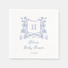 a blue and white monogrammed baby shower napkin