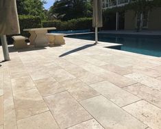 an empty pool with two benches next to it