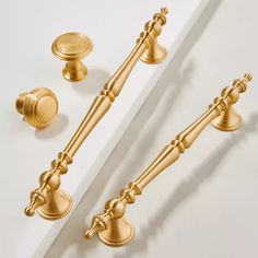 an image of two golden handles and knobs