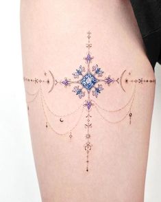 a woman's thigh with an intricate design on it