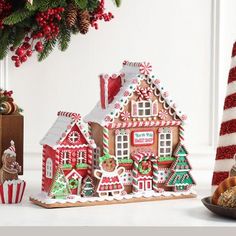 a christmas scene with gingerbread houses and candy canes