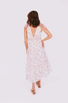 Get ready to turn heads with our EXCLUSIVE Make You Mine Dress! The v-neckline, ribbon straps, and elastic under bust not only create a flattering fit, but also add a touch of elegance. And with a beautiful floral pattern, you'll be sure to stand out at any event. You'll be the envy of everyone (including us) in this must-have dress!! Details V-neckline Ribbon straps Elastic under bust Floral pattern Sizing *Measurements are taken with item hanging and fabric unstretched.* Approximate measurements: SIZE LENGTH BUST XS 47” 30” Small 48" 32" Medium 48” 34” Large 48” 36” X-Large 50" 38" 1XL 51" 40" 2XL 52" 42" 3XL 53" 44" Runs small, consider sizing upFabric has no stretchModels are 5’8” wearing small and 5'6" wearing 1XL Material Self: 100% Polyester, Lining: 100% PolyesterHand wash cold Do Pink Floral Design, Long Puff Sleeves, Dress Details, Dresses Xs, Pink And Green, Must Haves, Floral Pattern, Turn Ons, Make It Yourself