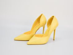 Elevate your style with these leather D'Orsay heels in light yellow by Bigtree, perfect for adding a pop of color to any outfit. These elegant shoes feature a sleek pointy toe and a high stiletto heel, offering a sophisticated and feminine silhouette. The D'Orsay design, with its open sides, adds a touch of modern flair while ensuring a comfortable fit. Ideal for both formal events and nights out, these pumps combine bold style with timeless elegance. A must-have for any fashion-forward wardrobe Yellow Almond Toe Court Shoes For Spring, Yellow High Heel Court Shoes For Formal Occasions, Yellow Court Shoes For Spring, Yellow Pointed Toe Court Shoes For Formal Occasions, Yellow Closed Toe Heels For Formal Occasions, Yellow Court Shoes For Spring Formal Occasions, Yellow Court Shoes For Spring Formal Events, Chic Yellow Almond Toe Heels, Elegant Yellow Heels For Spring