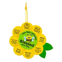 a yellow flower shaped ornament with the words, bee - crittes are the