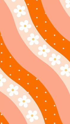 an orange and white wallpaper with daisies on the bottom right hand corner, as well as dots in the middle