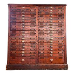 an old wooden cabinet with many drawers