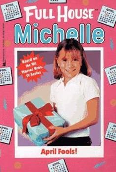 a girl holding a blue box with a red bow on it and calendars around her