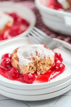 a white plate topped with dessert covered in icing