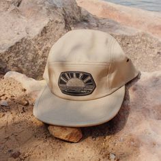 Welcoming the third and final addition to our Summer Adventure Series...The Sun Seeker! Because who doesn't want to seek more sunshine?!? Complete with warm tones and fun line work, this is the go-to accessory you need for all your sunny adventures! Choose from a black or khaki low profile 5 panel hat with our black & gold, laser engraved faux leather patches! Or if you're needing a bit more color in your life, take a look at our nylon pinch-front rope hat in mustard yellow! Summer Outdoor Baseball Cap With Uv Protection, Summer Baseball Cap With Uv Protection For Outdoor, Summer Baseball Cap For Outdoor, One Size Fits Most, Summer Baseball Cap, One Size Fits Most For Outdoor, Summer Baseball Cap For Outdoor, Summer Trucker Hat For Outdoor, Summer Cap For Outdoor Activities, Casual Uv Protection Hat For Camping, Summer Outdoor Snapback Trucker Hat