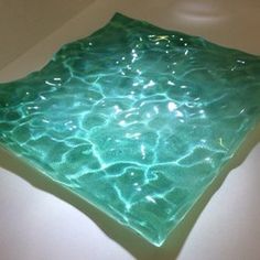 a square glass plate sitting on top of a white counter