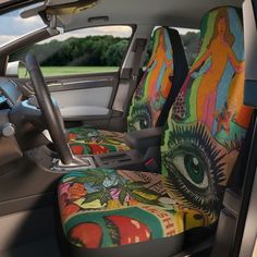 the interior of a car with an all seeing eye seat cover