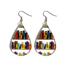 a pair of earrings with bookshelves in the shape of tears on white background