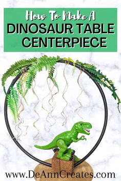 a dinosaur table centerpiece made out of wood and wire with text overlay that reads how to make a dinosaur table centerpiece