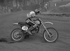 a man riding on the back of a dirt bike