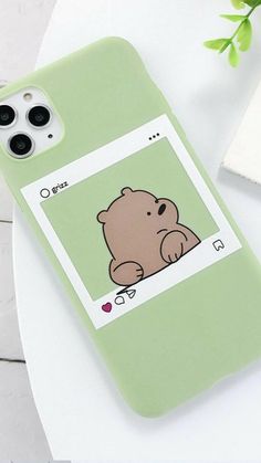 a green phone case with a brown bear on the front and back cover that says tu movii