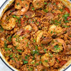 a large pot filled with shrimp and rice