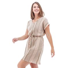 Planning a beach or poolside vacation? The Selma Dress is your go-to. This stunning, sustainable dress is the perfect cover-up that can take you from sand to dinner in a cinch. The yarn-dyed crepe fabric is breathable and has a unique, slubby feel to it. The Dolman sleeves are absolute freedom for the arms, plus they are very flattering to any body shape. Pockets at each hip are amazing and the drawcord allows you to add a bit of shape to your style. Fair Trade Certified™ and 100% organic cotton Beige Beachwear Sundress For Beach, Beige V-neck Dress For Vacation, Beige Beachwear Sundress, Natural Color Summer Dress For Vacation, Natural Color Summer Vacation Dress, Beige Casual Dresses For Vacation, Casual Beige Dresses For Vacation, Beige Flowy Beach Dress, Beige Beach Party Dress For Vacation