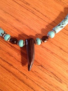 "Native style choker necklace.  Great for the man in your life. 17\" long  with stone talon, glass, metal  and acrylic beads and a spring clasp. Handmade in Canada Free shipping Thank you for browsing with Thistledew by JAG! I invite you to also visit my collectibles shop: TDCcollections on ETSY!" Turquoise Jewelry With Black Beads For Festival, Southwestern Style Black Beads Jewelry For Gift, Southwestern Style Black Bead Jewelry For Gifts, Southwestern Style Jewelry With Black Beads For Gift, Adjustable Southwestern Jewelry With Black Beads, Adjustable Southwestern Style Jewelry With Black Beads, Southwestern Style Choker Jewelry Gift, Unique Adjustable Turquoise Crystal Necklaces, Adjustable Southwestern Style Pendant Necklace