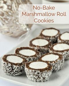 no - bake marshmallow roll cookies on a white plate with silverware in the background