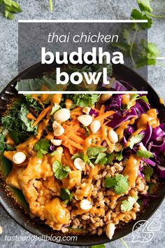 a bowl filled with chicken and vegetables on top of a table next to green leaves