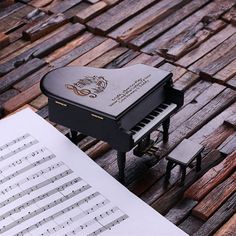 a piano sitting on top of a wooden table