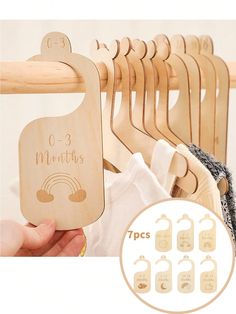 wooden clothes hangers with names and numbers on them