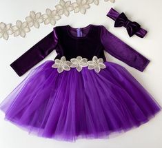 Purple dress with puffy skirt. Fabric-purple velour on the top, purple tulle skirt and beige flower lace on the waist.  It is a set with matching accessories headband. Also you can order purple booties (choose in the option colour purple): https://www.etsy.com/listing/767522205/baby-shoes-baby-girl-outfit-baby-velvet?click_key=98551c266e14c09a2f906b40d23496c8abb149c7%3A767522205&click_sum=23a6d009&ref=shop_home_active_2&crt=1&sts=1 Also you can find other dresses in my shop: https://www.etsy.com Purple Tulle Skirt, Purple Booties, Purple Flower Girls, Flower Girl Dress Tulle, Purple Flower Girl Dress, Purple Velvet Dress, Buffalo Plaid Dress, Dress For Baby Girl