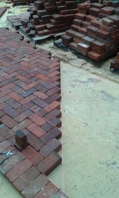 bricks are laid out on the ground and ready to be used