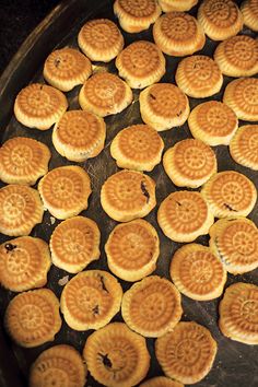 small waffles are cooking in a pan on the stove top, ready to be cooked