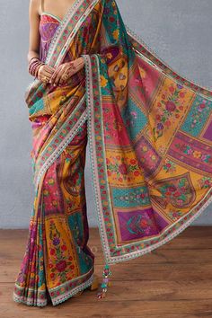 Purple pre-draped saree crafted in chanderi base with all over spade bloom gulshan print and tassel embellishments on the corners. - Aza Fashions Multicolor Pre-draped Saree With Unstitched Blouse For Puja, Festive Multicolor Unstitched Pre-draped Saree, Designer Multicolor Pre-draped Saree, Wedding Semi-stitched Pre-draped Saree With Printed Motifs, Transitional Pre-draped Saree With Printed Motifs, Wedding Pre-draped Semi-stitched Saree With Printed Motifs, Multicolor Cotton Silk Pre-draped Saree With Zari Work, Navratri Pre-draped Georgette Saree With Printed Motifs, Pre-draped Georgette Saree With Printed Motifs For Navratri