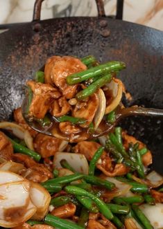 stir fry with chicken and green beans in a wok