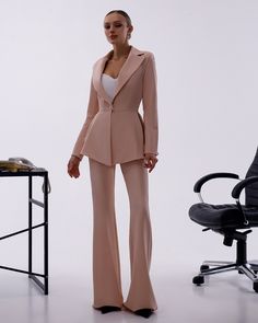 Please pay attention to suit measurements Pants total length is 115 cm or 45.2 inches (from waist to the bottom) Inseam length is 92 cm or 36.2 inches (from crotch to the bottom) Blazer length along the back 66 cm or 26 inches  Sleeve length is 62 cm or 24.4 inches 2-piece Womens Blazer Trouser Suit for office, business meetings, formal events and special occasions like civil wedding, elopement or birthday.  DETAILS -  flared pants -  side pockets -  slim fit   -  high rise -  blazer is buttoned -  lined -  peplum bottom MATERIAL Premium quality suiting fabric, which consists of viscose mostly and a bit of polyester and elastane SIZES The models in photos are wearing a size S (4 US numeric) Available in 4 sizes: XS= 2 US numeric BUST 32-34 inches or 82-86 cm WAIST 23-24.8 inches or 59-63 c Elegant Office Sets With High-waisted Pants, Elegant Formal Set With High-waisted Pants, Tailored Formal Trouser Sets, Tailored Trousers Sets For Formal Occasions, Fitted Long Sleeve Pantsuit For Wedding, Fitted Long Sleeve Wedding Pantsuit, Elegant Dress Pants For Wedding, Elegant Full-length Dress Pants For Wedding, Elegant Fitted High-waisted Pants Set