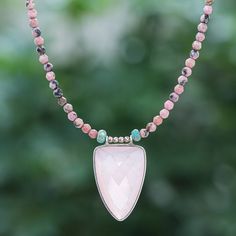 A translucent pink chalcedony triangle centers this lovely necklace designed by Thailand's Somluck Komolmith. The artisan hand threads pink rhodonite green jasper and 18k rose gold-plated brass beads to create the necklace then finishes the strand with a sterling silver clasp and extender chain. Pink Rhodonite, Pink Chalcedony, Green Jasper, Brass Beads, Lovely Necklace, Necklace Designs, Spring Rings, Rose Gold Plates, Jewelry Shop