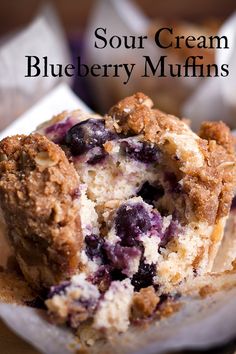 blueberry muffins are stacked on top of each other with the words sour cream blueberry muffins above them