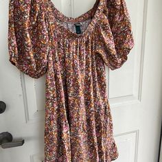 Super Pretty Floral. Very Retro Look But Brand New! Short ‘Balloon’ Sleeves. Oversized. Elastic Running All Across Neckline So Can Wear This Off The Shoulder Too! So Lightweight And Breezy It’ll Take You From Spring Into Summer And The Colors Can Take You Into Early Fall!! Really Get Your $’S Worth!! It’s Tiered In Subtle Ruffle Look But Hard To See In Pix Because Of The Pattern. Just Lovely And Girlie In Person! Comes Several Inches Above Knee. Medium Will Def Fit Also. Cute With Sandals Or Whi Bohemian Sundress With Ditsy Floral Print For Vacation, Bohemian Sundress With Ditsy Floral Print For Summer, Boho Print Spring Sundress, Spring Beach Boho Peasant Dress, Peasant Style Boho Dress For Beach In Spring, Spring Peasant Style Boho Beach Dress, Casual Multicolor Boho Print Sundress, Multicolor Casual Boho Dress With Short Sleeves, Casual Multicolor Boho Dress With Short Sleeves